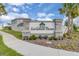 Entrance to the Savannah Palms community featuring stone accents and lush landscaping at 1425 Lone Wood Blvd, Orlando, FL 32828