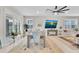 Bright dining room with shutters and large windows, adjacent to the living room at 1425 Lone Wood Blvd, Orlando, FL 32828