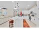 Bright, open kitchen featuring an island, stainless appliances and white cabinets at 1425 Lone Wood Blvd, Orlando, FL 32828