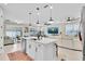Bright, open-concept kitchen featuring a kitchen island and stainless steel appliances at 1425 Lone Wood Blvd, Orlando, FL 32828