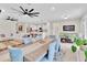 Spacious living area featuring a dining table and chairs, open to the kitchen and Gathering room at 1425 Lone Wood Blvd, Orlando, FL 32828