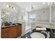 Bright bathroom featuring double sinks, a bathtub, and modern fixtures at 14501 Damai Ln, Orlando, FL 32821