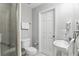 Bright and airy bathroom featuring tiled shower, neutral paint, and modern fixtures at 14501 Damai Ln, Orlando, FL 32821
