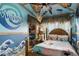 Bright Moana-themed bedroom featuring custom wave mural and unique decor at 14501 Damai Ln, Orlando, FL 32821
