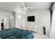 Cozy bedroom with a comfortable bed, dresser, and a view from the window at 14501 Damai Ln, Orlando, FL 32821