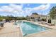 Resort-style community pool with a splash pad and lounge chairs for relaxing by the water at 14501 Damai Ln, Orlando, FL 32821