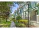 Attractive townhomes with bay windows, stone accents, and neatly manicured landscaping at 14501 Damai Ln, Orlando, FL 32821