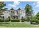 Charming townhome with a landscaped front yard and lush greenery, offering curb appeal and a welcoming entrance at 14501 Damai Ln, Orlando, FL 32821