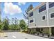 Well-maintained townhome featuring an attached garage and neatly landscaped surroundings at 14501 Damai Ln, Orlando, FL 32821