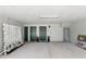 Spacious garage with a decorative wall, multiple doors and ample room for parking at 14501 Damai Ln, Orlando, FL 32821