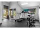 Bright gym offers treadmill, stationary bike, and dumbbell racks for a complete workout at 14501 Damai Ln, Orlando, FL 32821