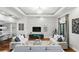 Bright and airy living room with stylish sofas, hardwood floors, and large windows for natural light at 14501 Damai Ln, Orlando, FL 32821
