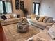 Comfortable living room with hardwood floors, stylish furnishings, and a decorative rug at 14501 Damai Ln, Orlando, FL 32821