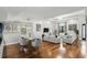Elegant living and dining area with hardwood floors, chic furniture, and ample space for Gathering gatherings at 14501 Damai Ln, Orlando, FL 32821