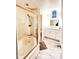 Bright bathroom featuring tub/shower combo, white vanity with granite countertop, and a small window at 1486 Farrindon Cir, Lake Mary, FL 32746