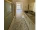Bathroom featuring a marble-topped vanity and a glass enclosed shower at 1486 Farrindon Cir, Lake Mary, FL 32746