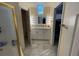 Bathroom featuring a shower with glass door, a vanity with white cabinets and tile flooring at 1486 Farrindon Cir, Lake Mary, FL 32746