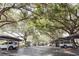Carport parking spaces beneath mature shady trees in the community at 1486 Farrindon Cir, Lake Mary, FL 32746
