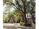 Well-maintained community building with column architecture, lush landscaping, and mature trees at 1486 Farrindon Cir, Lake Mary, FL 32746