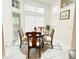 Cozy dining area featuring white marble floors, bright natural light, and a round table with four chairs at 1486 Farrindon Cir, Lake Mary, FL 32746