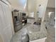 Kitchen featuring stainless steel appliances, granite countertops, and tile flooring at 1486 Farrindon Cir, Lake Mary, FL 32746