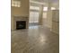 Living room with fireplace and marble-look flooring at 1486 Farrindon Cir, Lake Mary, FL 32746