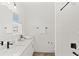 Clean, bright bathroom featuring a modern vanity, tile shower, and sleek fixtures for a relaxing space at 15444 Lebeau Loop, Winter Garden, FL 34787