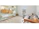 Bright bedroom features modern shelving, a desk, and a view from the window at 15444 Lebeau Loop, Winter Garden, FL 34787