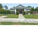 Exterior shot of community center with landscaping, bike racks, and manicured lawn at 15444 Lebeau Loop, Winter Garden, FL 34787