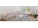 Bright living room features a comfortable sectional sofa, stylish rug, and an abundance of natural light from large windows at 15444 Lebeau Loop, Winter Garden, FL 34787