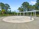 Community splash pad with shaded seating and nearby landscaping at 15444 Lebeau Loop, Winter Garden, FL 34787