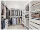 Organized walk-in closet features ample shelving and hanging space for clothing, shoes, and accessories at 15444 Lebeau Loop, Winter Garden, FL 34787