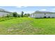 Expansive backyard featuring lush green grass, offering plenty of space for outdoor activities and relaxation at 1750 Mitten Ter, Deltona, FL 32738