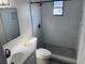 Modern bathroom featuring updated fixtures, tiled walk-in shower and sleek vanity at 1750 Mitten Ter, Deltona, FL 32738
