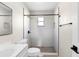 Modern bathroom featuring a sleek vanity, stylish fixtures, and tiled walk-in shower at 1750 Mitten Ter, Deltona, FL 32738