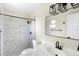 Modern bathroom showcasing a stylish vanity, sleek fixtures, and a tiled walk-in shower at 1750 Mitten Ter, Deltona, FL 32738