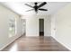 Spacious bedroom featuring wood-look flooring and neutral walls, ready for your personal touch at 1750 Mitten Ter, Deltona, FL 32738