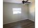 Bedroom features neutral walls, a ceiling fan, and vinyl plank flooring throughout at 1750 Mitten Ter, Deltona, FL 32738