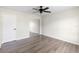 Clean bedroom with a mirrored closet, neutral walls, and wood-look floors at 1750 Mitten Ter, Deltona, FL 32738