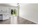 Bright dining area with backyard view, adjacent to kitchen, featuring wood-look flooring at 1750 Mitten Ter, Deltona, FL 32738