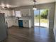 Bright kitchen featuring stainless appliances, stylish countertops and modern vinyl flooring at 1750 Mitten Ter, Deltona, FL 32738
