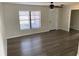 Bright living room features light walls, a ceiling fan, and vinyl plank flooring throughout at 1750 Mitten Ter, Deltona, FL 32738