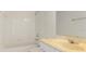 Well-lit bathroom showcasing a tub, shower, toilet and vanity with neutral tones at 181 Longview Ave, Kissimmee, FL 34747