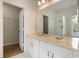 Bright bathroom features a double vanity, large mirror and separate walk-in shower at 181 Longview Ave, Kissimmee, FL 34747
