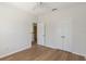 The bedroom features neutral walls, white trim, wood-look floors and ceiling fan at 181 Longview Ave, Kissimmee, FL 34747