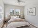 Inviting bedroom with a comfy bed, two windows, and stylish decor at 181 Longview Ave, Kissimmee, FL 34747