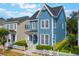 Exterior of home with blue siding, white fence, and manicured landscaping at 181 Longview Ave, Kissimmee, FL 34747