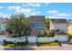 Back exterior of home with a white fence surrounding the backyard and detached garage at 181 Longview Ave, Kissimmee, FL 34747