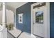 Charming home with a white door and blue siding at 181 Longview Ave, Kissimmee, FL 34747