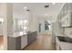 Open kitchen features gray cabinets, stainless appliances, and a tile floor at 181 Longview Ave, Kissimmee, FL 34747